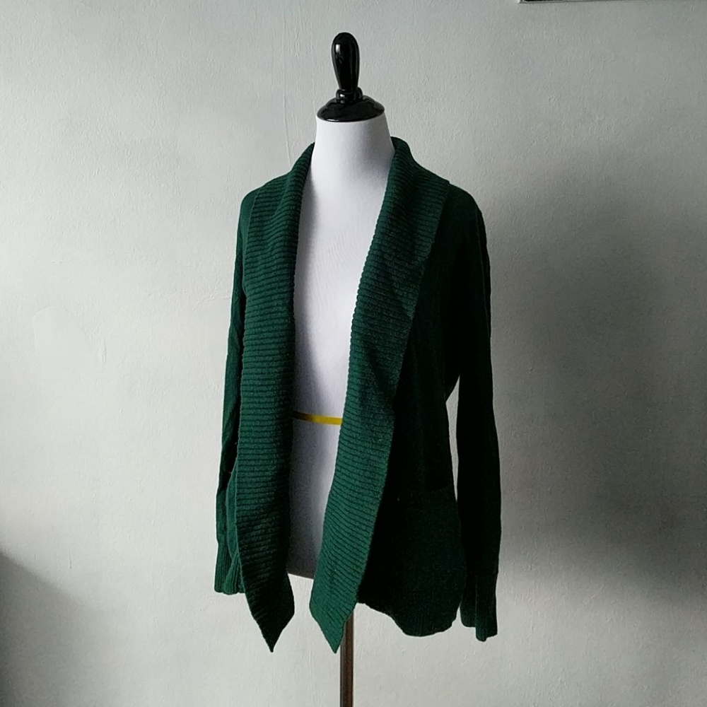 Green wool cardigan with pockets.